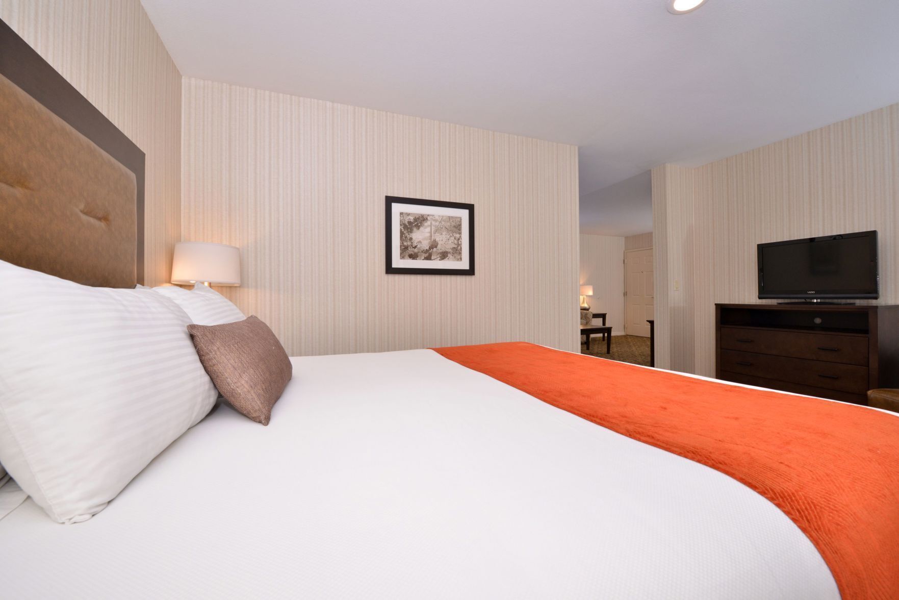 Premium bedding, desk, laptop workspace, blackout curtains