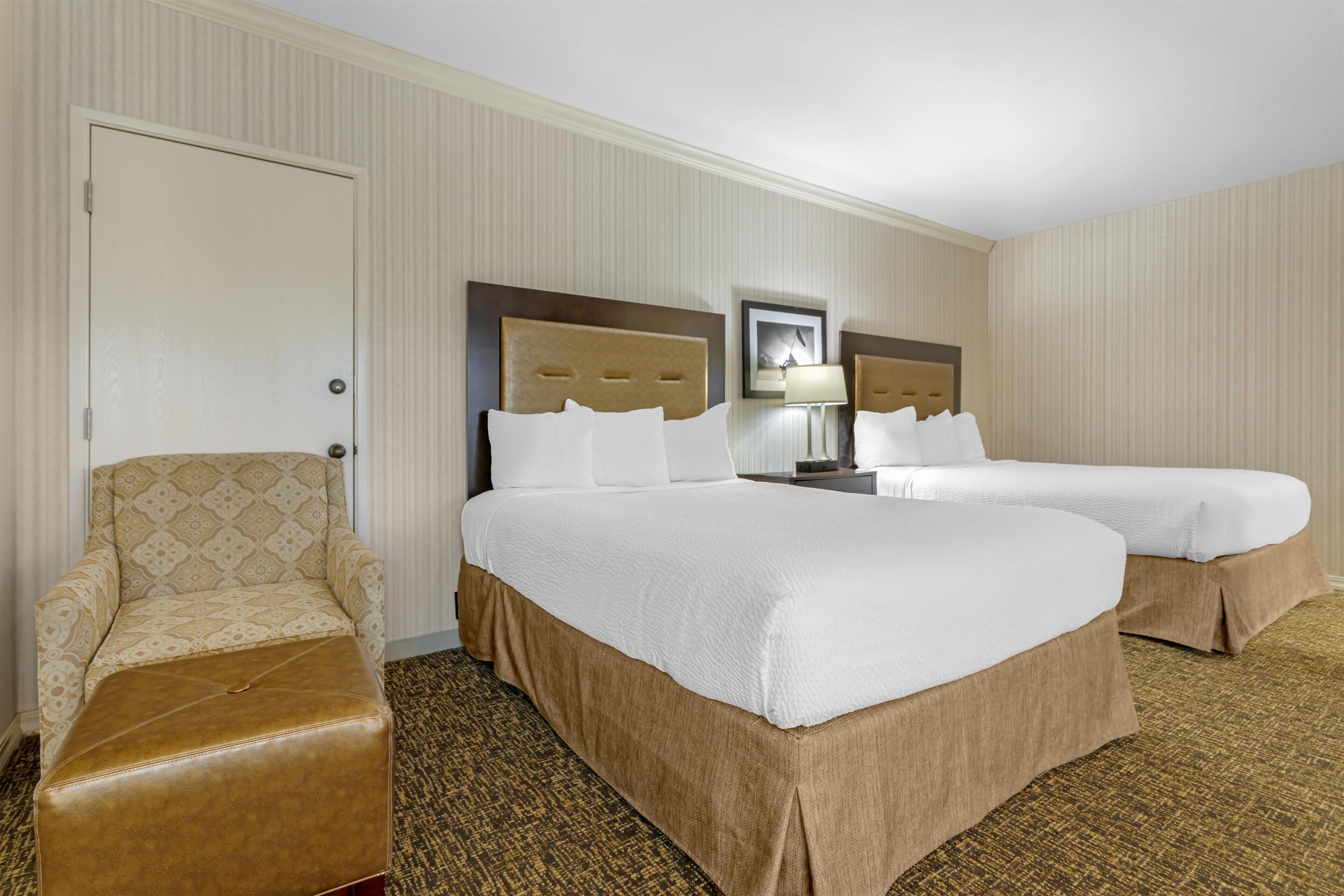 Premium bedding, desk, laptop workspace, blackout curtains