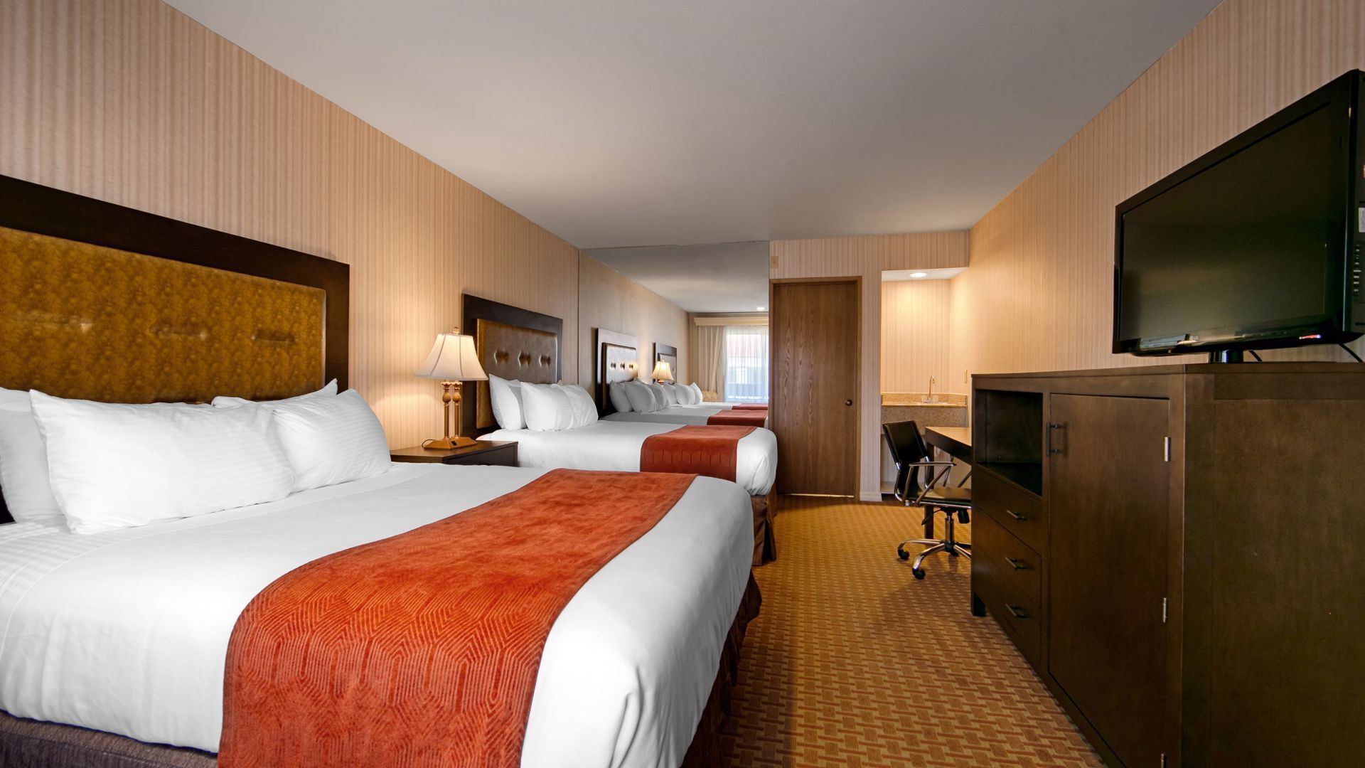 Premium bedding, desk, laptop workspace, blackout curtains