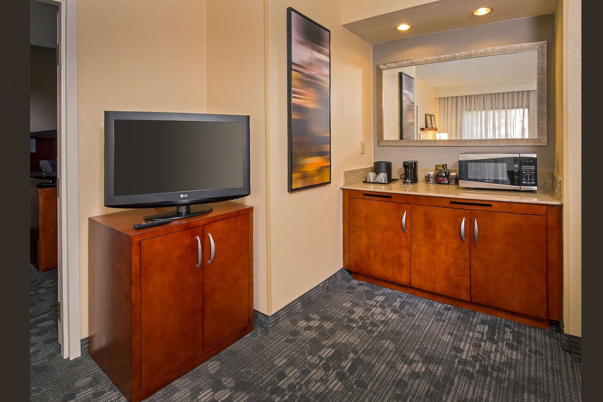 Desk, laptop workspace, blackout drapes, iron/ironing board