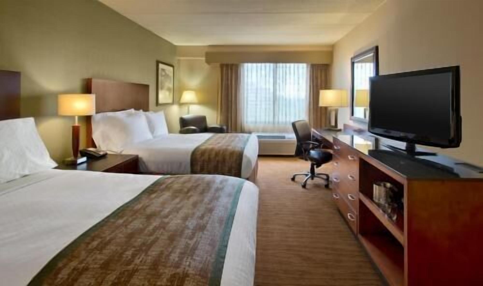 Premium bedding, down comforters, pillowtop beds, in-room safe