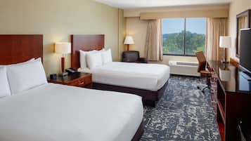 Premium bedding, down comforters, pillowtop beds, in-room safe