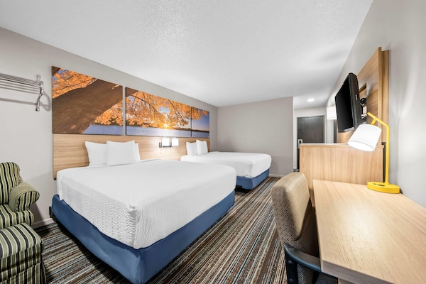 Standard Room, 2 Queen Beds | Cribs (free), WiFi (free), bed sheets