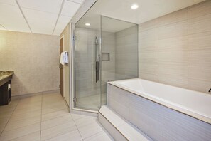 Suite, 1 King Bed, Kitchenette | Bathroom | Combined shower/tub, hydromassage showerhead, hair dryer, towels