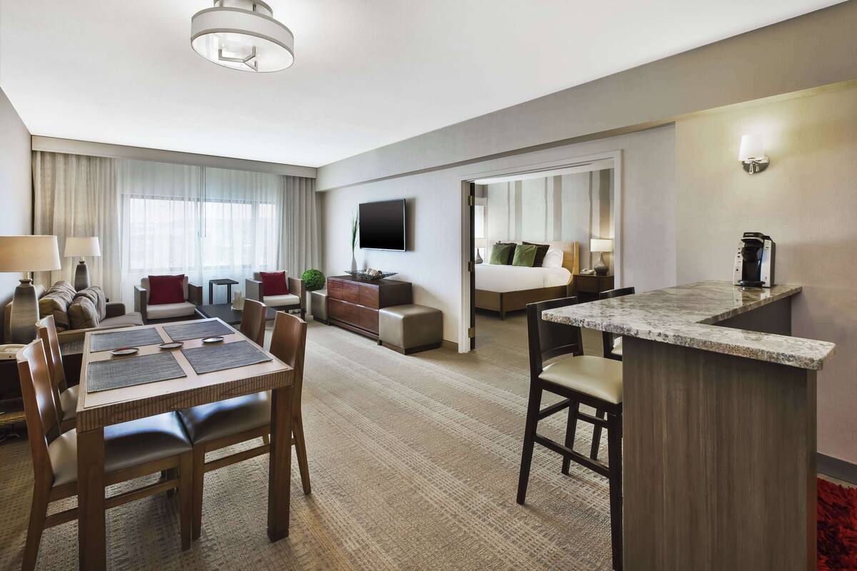 suite, 1 king bed, kitchenette | living area | flat-screen tv, video game console, pay films