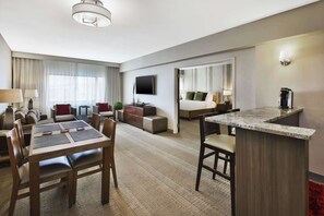 Suite, 1 King Bed, Kitchenette | Living area | Flat-screen TV, video-game console, pay movies