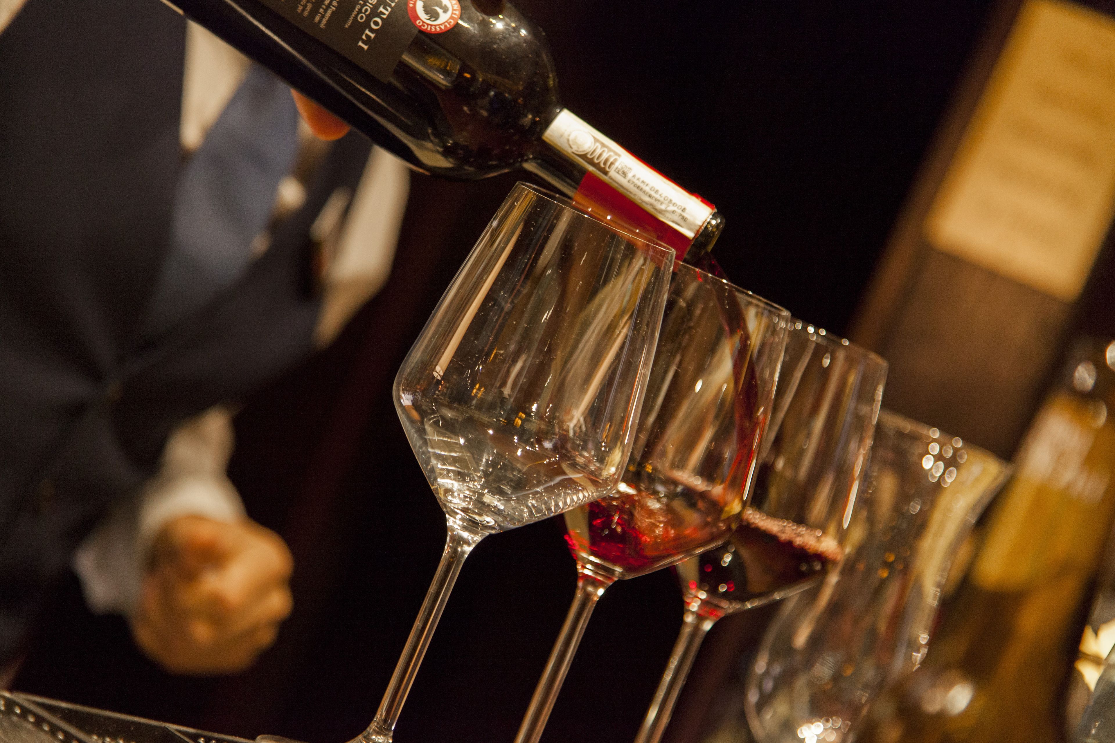 A bottle being poured into a glass.