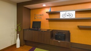 A reception desk with a computer, printer, and a sign indicating 'Connect & Print' services. - Best Western Allentown Bethlehem Lehigh Valley Inn & Suites (Bethlehem)