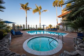 Outdoor pool, a heated pool, open 8 AM to 10 PM, sun loungers