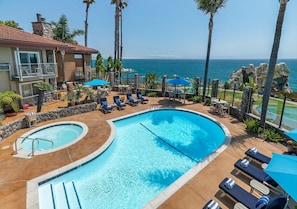 Outdoor pool, a heated pool, open 8 AM to 10 PM, pool loungers