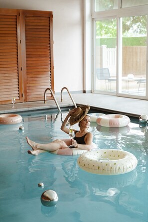 Indoor pool, open 6:30 AM to 10:00 PM, pool loungers