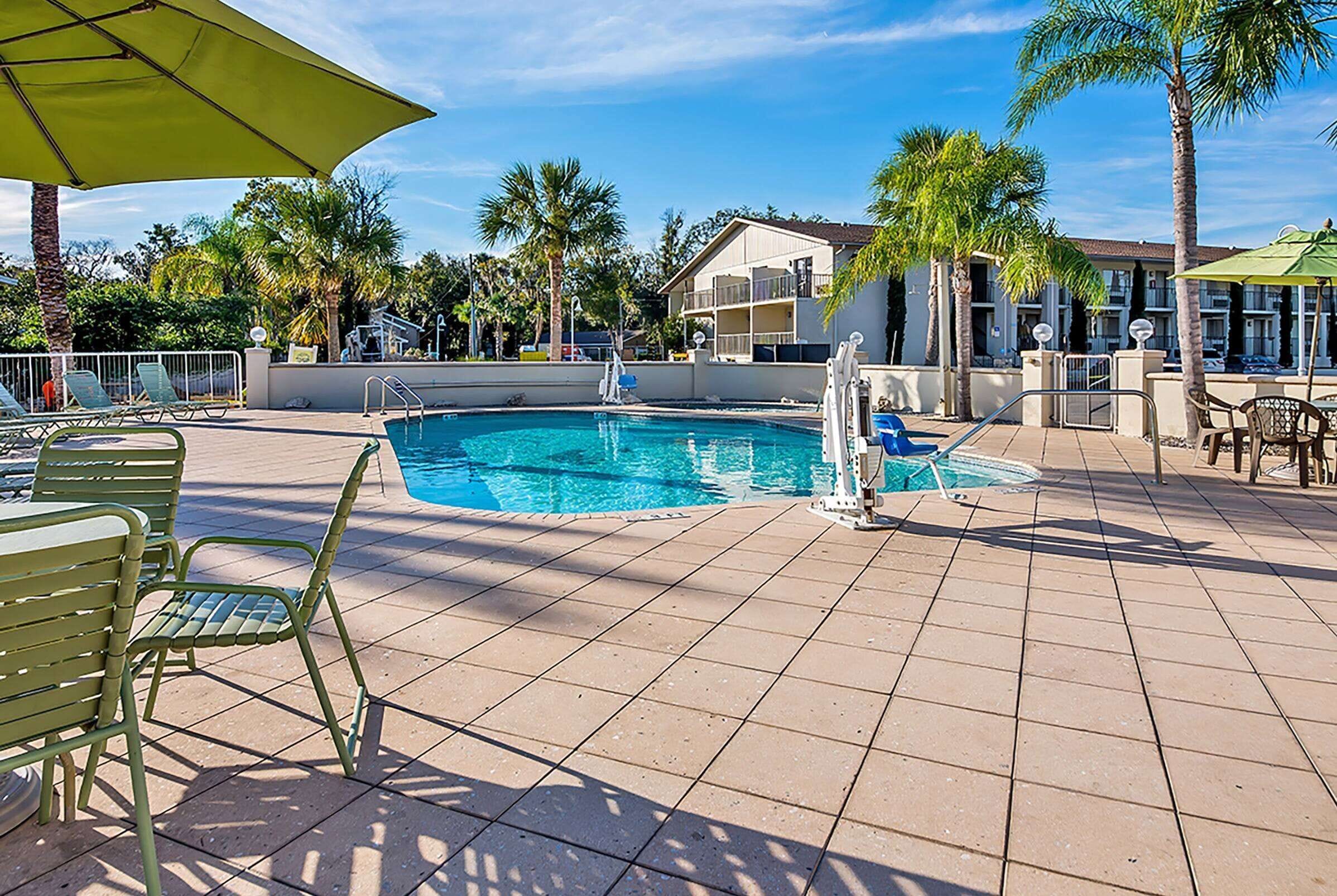 outdoor pool, pool umbrellas, pool loungers