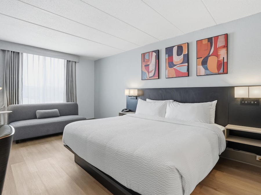 Premium bedding, desk, laptop workspace, blackout curtains