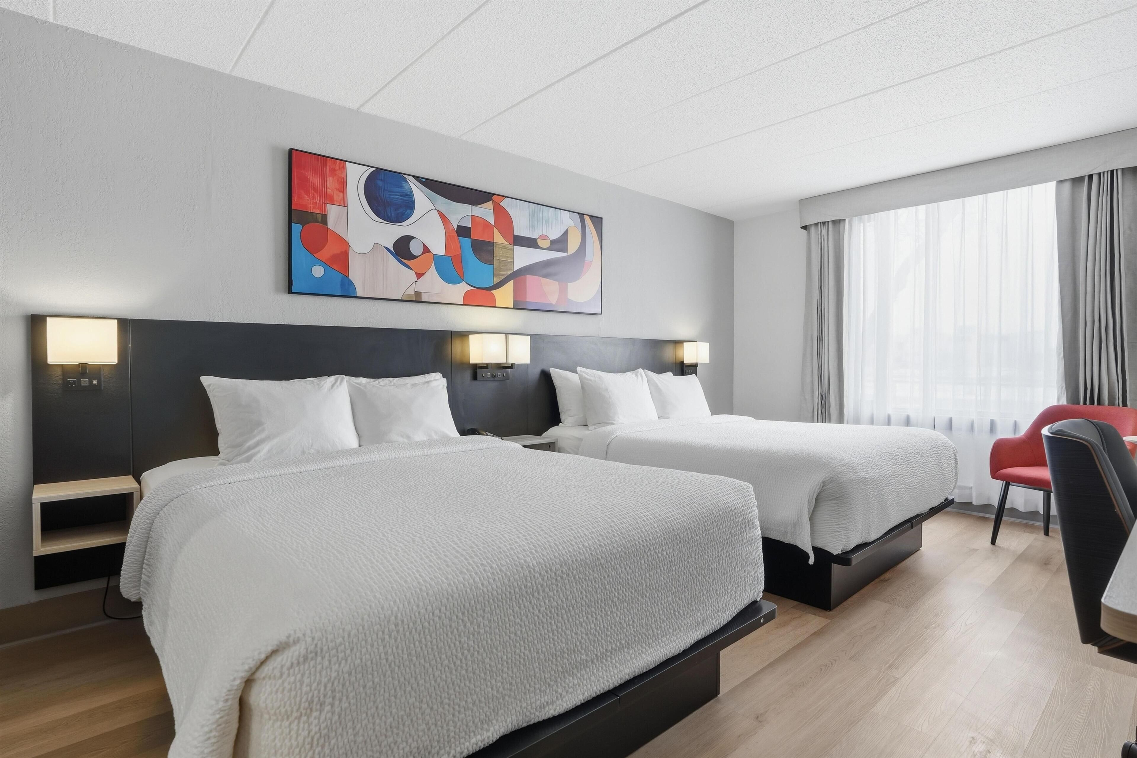 Premium bedding, desk, laptop workspace, blackout curtains