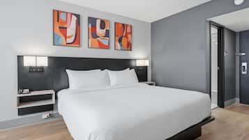 Premium bedding, desk, laptop workspace, blackout curtains