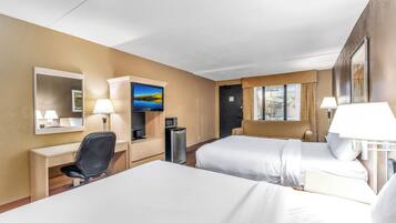 Premium bedding, desk, laptop workspace, blackout drapes