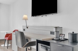 Premium bedding, desk, laptop workspace, blackout drapes