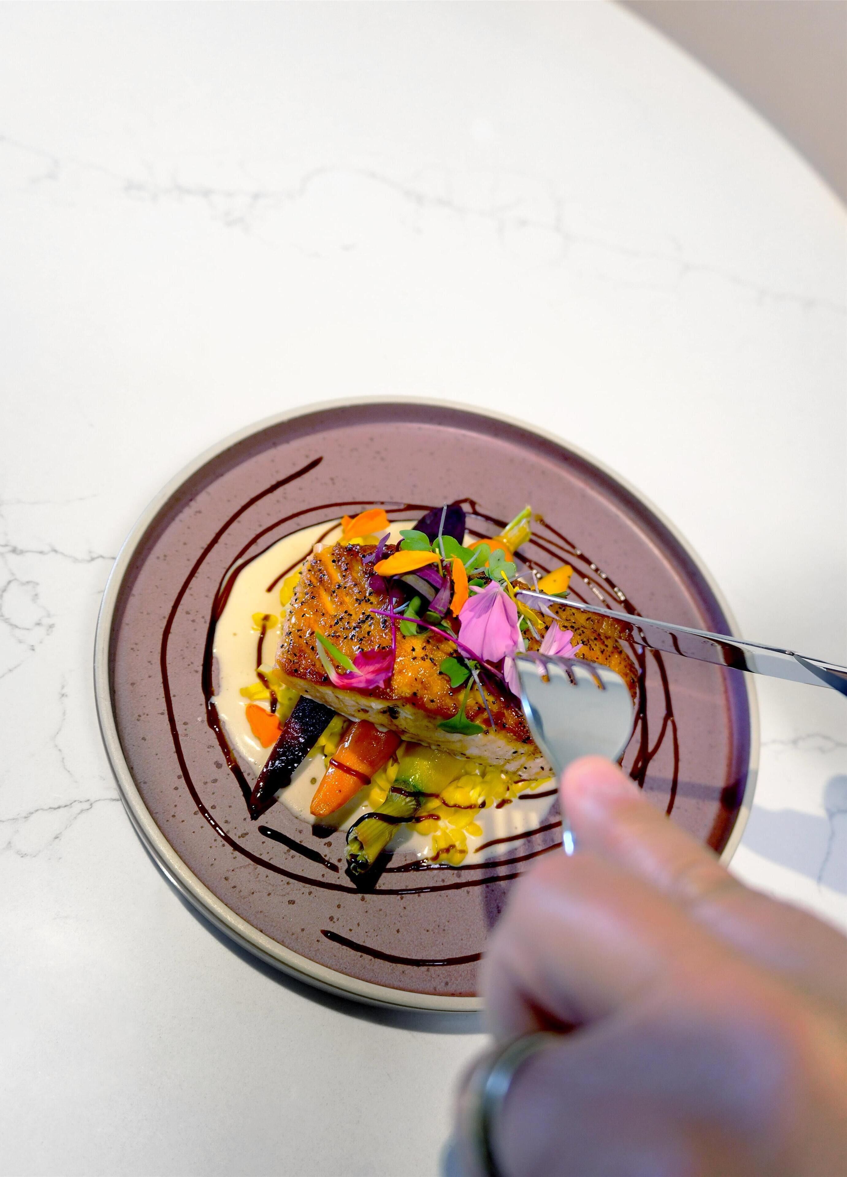A plate of food with a fork.