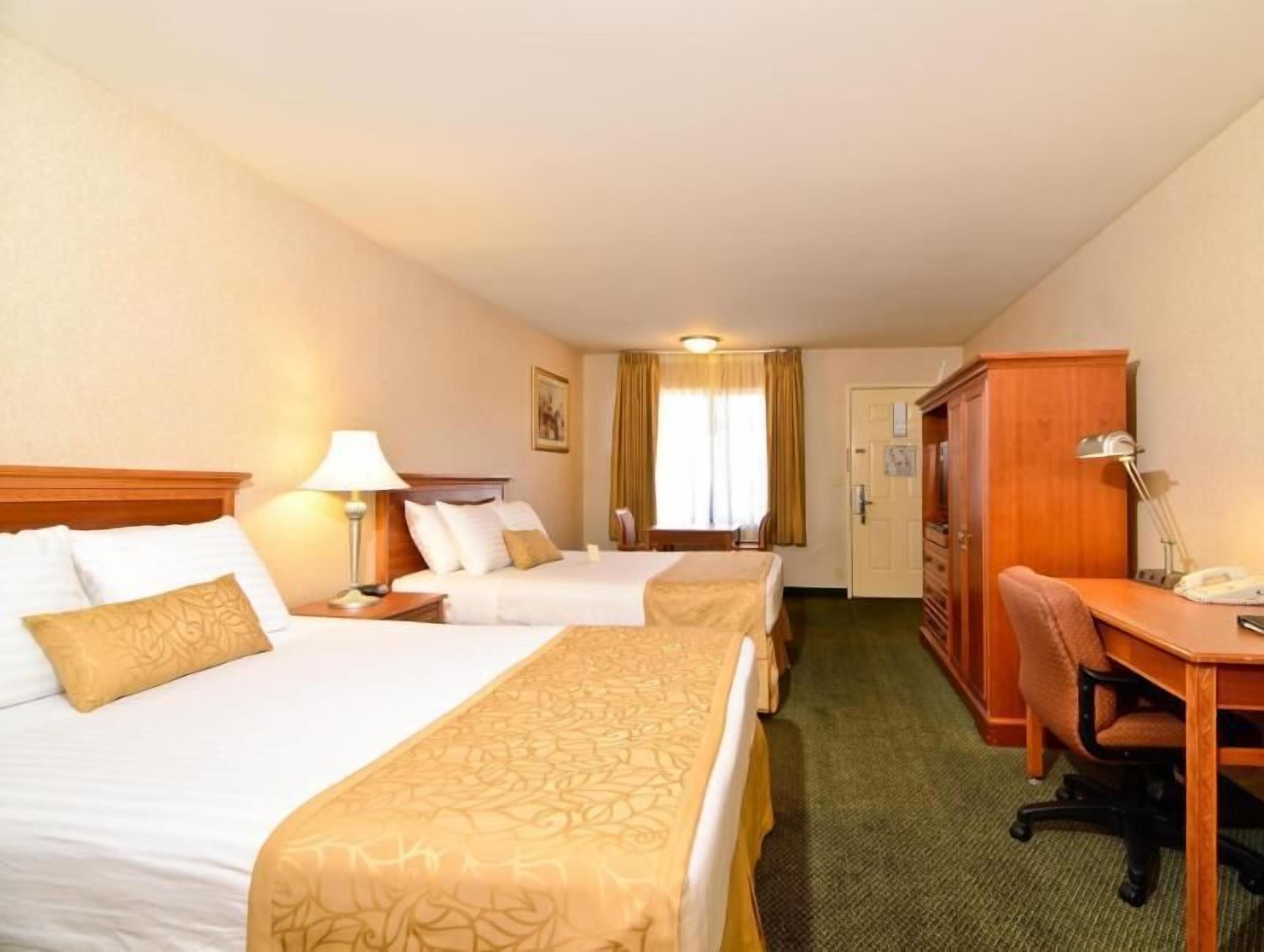 Premium bedding, desk, laptop workspace, iron/ironing board