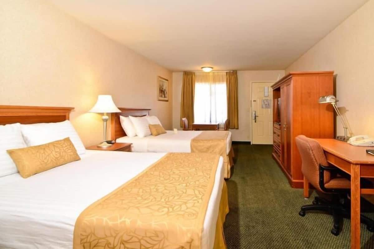 Premium bedding, desk, laptop workspace, iron/ironing board