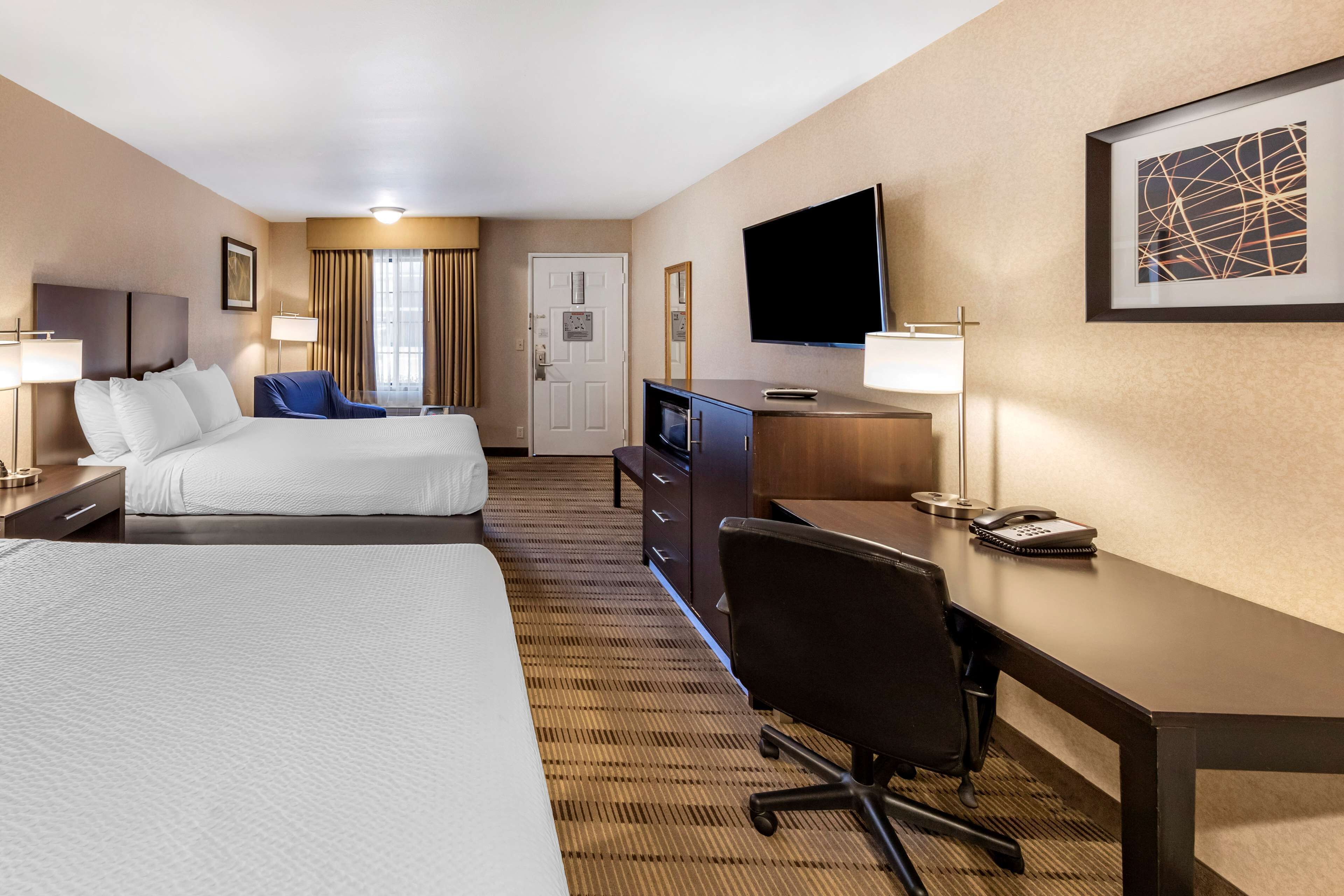 standard room, 2 queen beds, non smoking, refrigerator & microwave | premium bedding, desk, laptop workspace, iron/ironing board