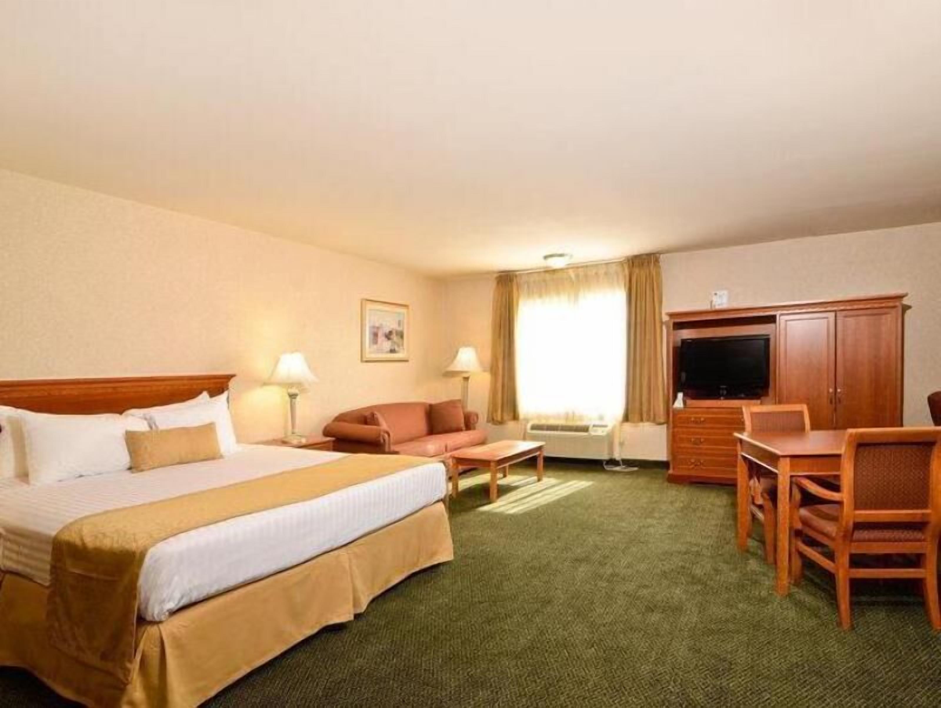 Premium bedding, desk, laptop workspace, iron/ironing board