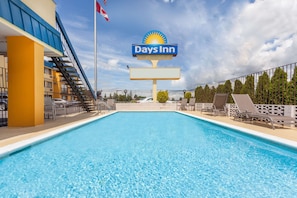 Seasonal outdoor pool, open 10:00 AM to 10:00 PM, sun loungers