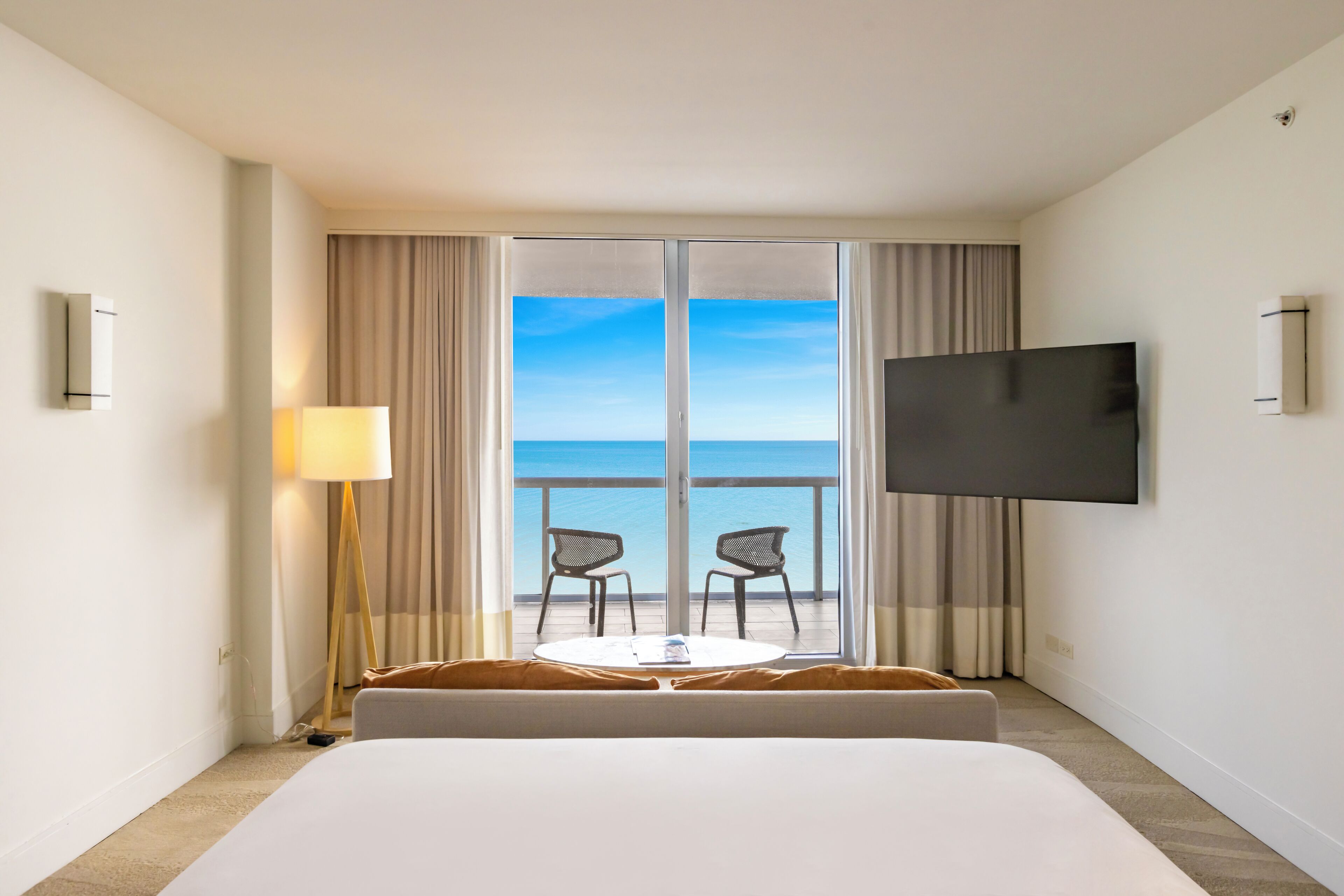 Oceanfront Junior Suite King with Balcony | Minibar, in-room safe, blackout drapes, iron/ironing board