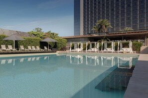 Seasonal outdoor pool, cabanas (surcharge), pool umbrellas