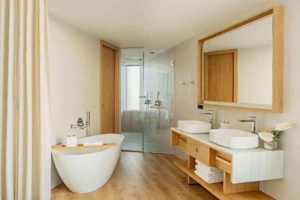 Bathroom | Separate tub and shower, designer toiletries, hair dryer, bathrobes