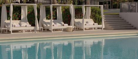 Seasonal outdoor pool, cabanas (surcharge), pool umbrellas