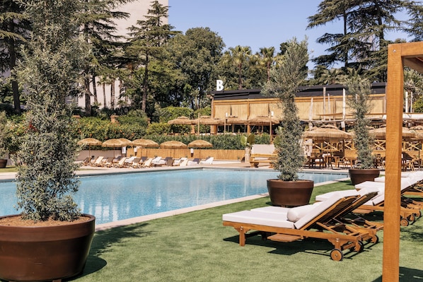 Seasonal outdoor pool, cabanas (surcharge), pool umbrellas