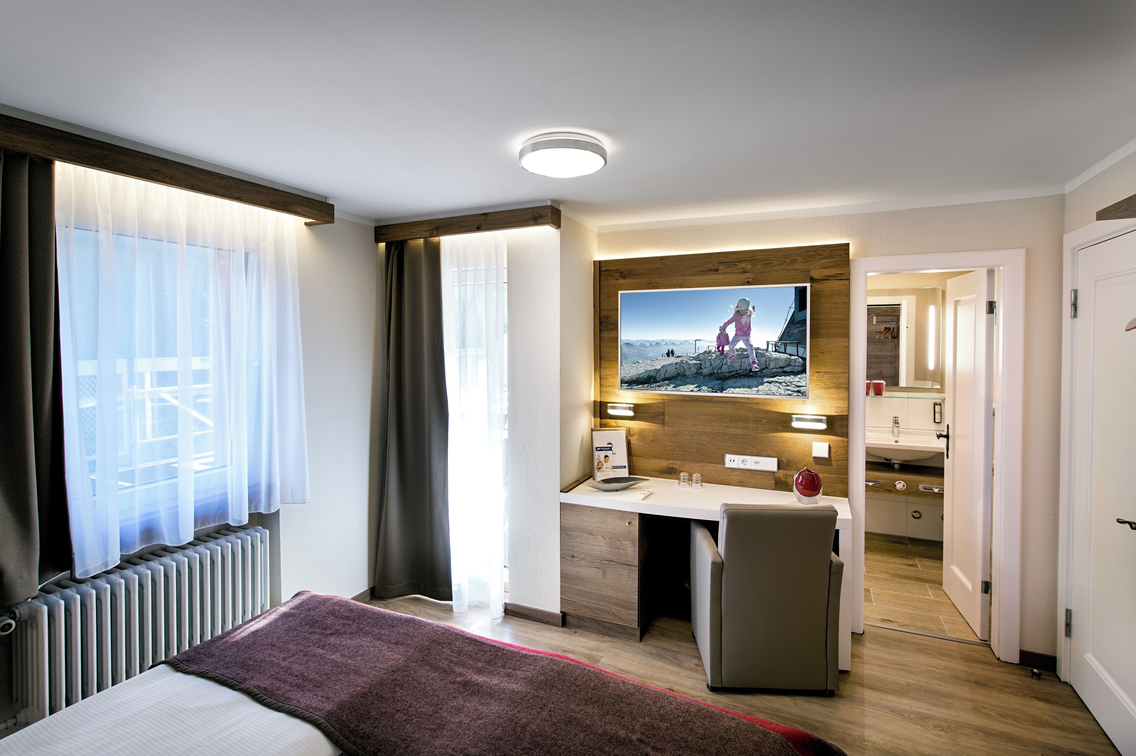 economy double room, mountain view | premium bedding, in-room safe, desk, blackout curtains