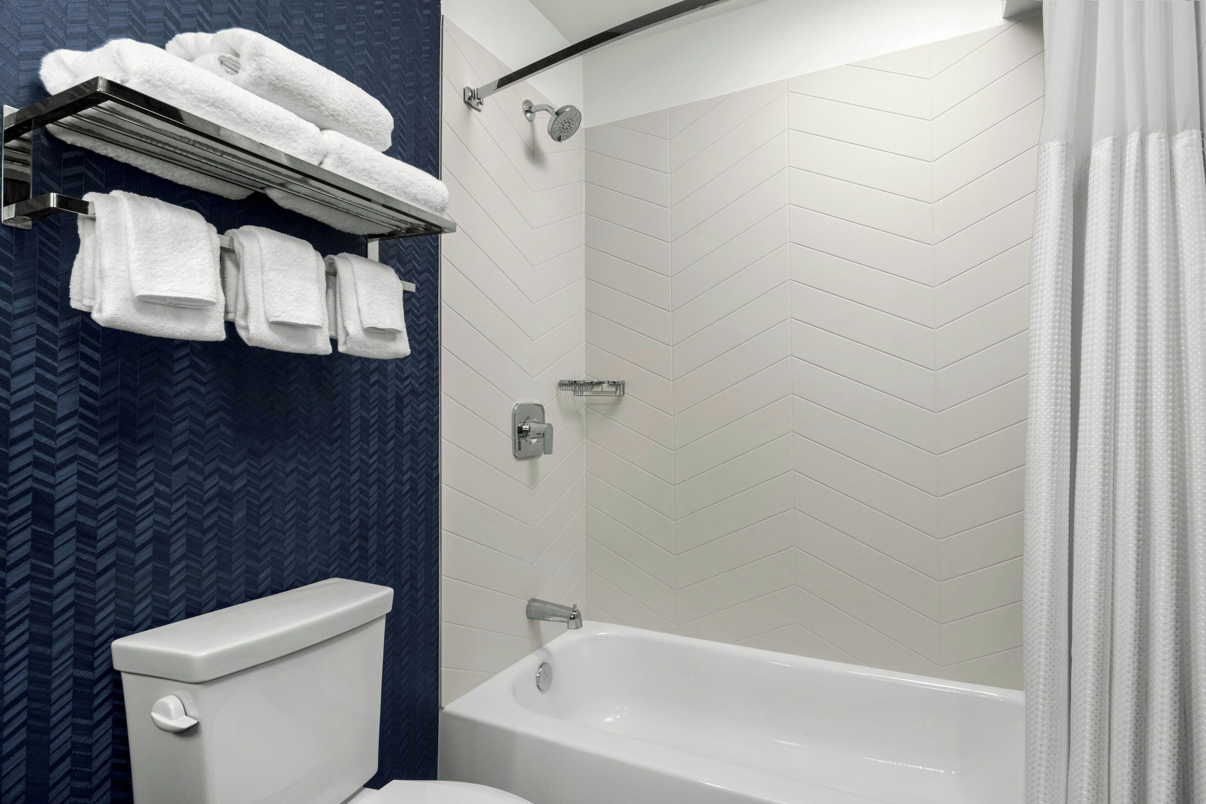 combined shower/bathtub, free toiletries, hair dryer, towels