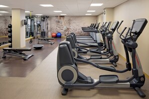 A gym with multiple treadmills, weight machines, and exercise balls. - The Westin Governor Morris, Morristown (Morristown)
