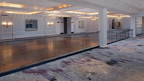 A spacious hotel lobby with a high ceiling, chandeliers, and a patterned carpet. - The Westin Governor Morris, Morristown (Morristown)