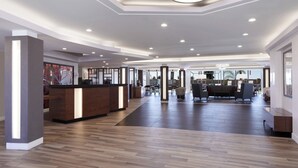 A spacious lobby with a reception desk, seating area, and modern lighting. - Fairfield Inn & Suites by Marriott Camarillo (Camarillo)
