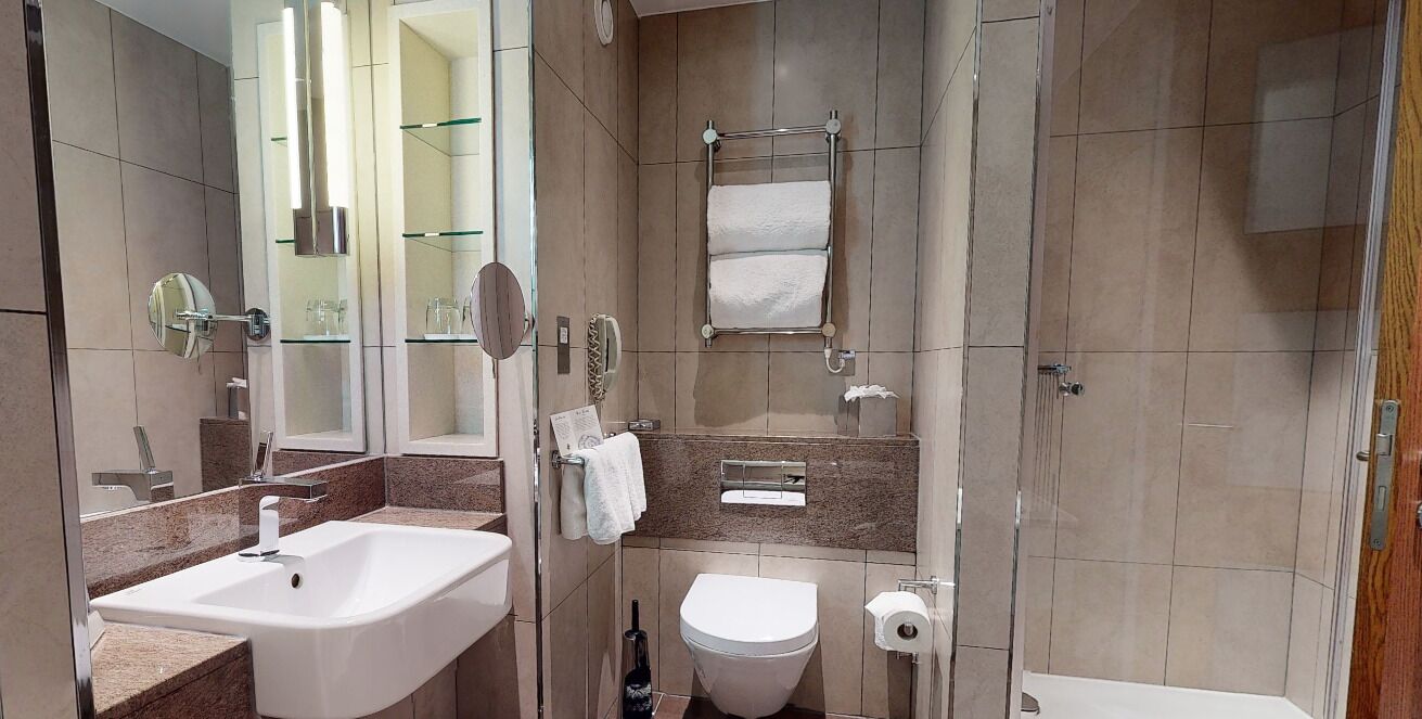 designer toiletries, hair dryer, bathrobes, towels