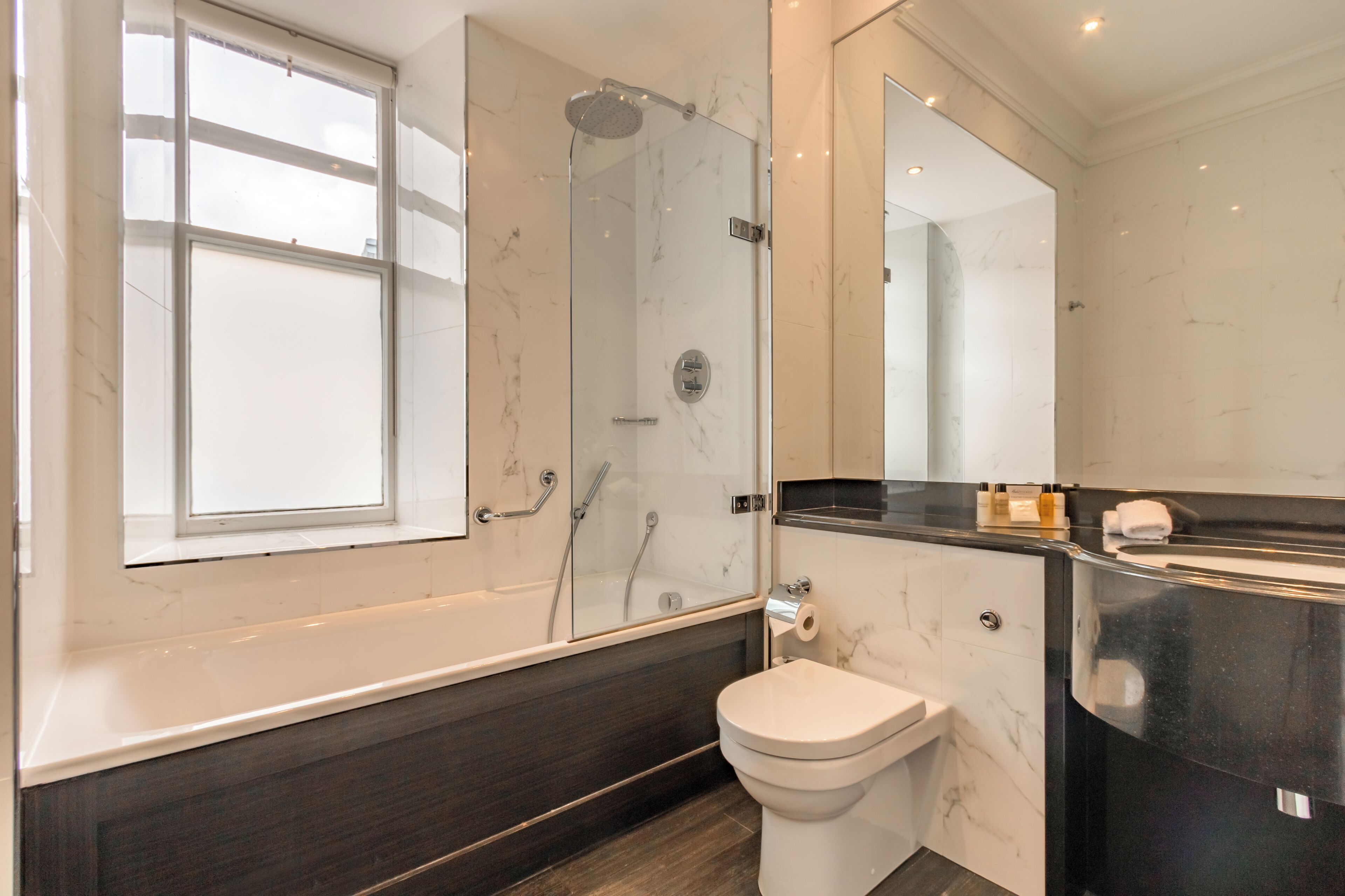 designer toiletries, hair dryer, bathrobes, towels