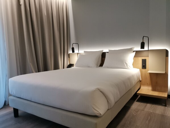 Premium bedding, down comforters, memory foam beds, minibar