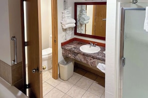 Suite, 1 King Bed, Non Smoking | Bathroom | Combined shower/tub, free toiletries, towels