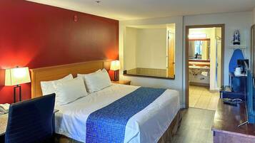 Suíte, 1 cama King, para não fumantes | Escrivaninha, ferros/tábuas de passar roupa, Wi-Fi de cortesia