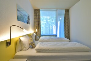 Habitación doble Confort | Ropa de cama de alta calidad y caja de seguridad en la habitación 