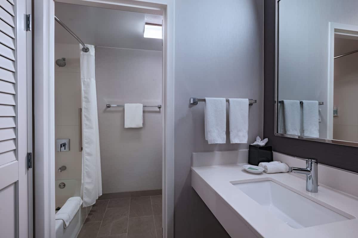 premium bedding, desk, laptop workspace, blackout curtains