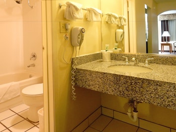 Combined shower/tub, eco-friendly toiletries, hair dryer, towels at Mardi Gras Hotel & Casino