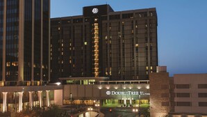 A hotel with a modern facade, large windows, and a prominent sign for "DoubleTree by Hilton". - DoubleTree by Hilton Omaha Downtown (Omaha)