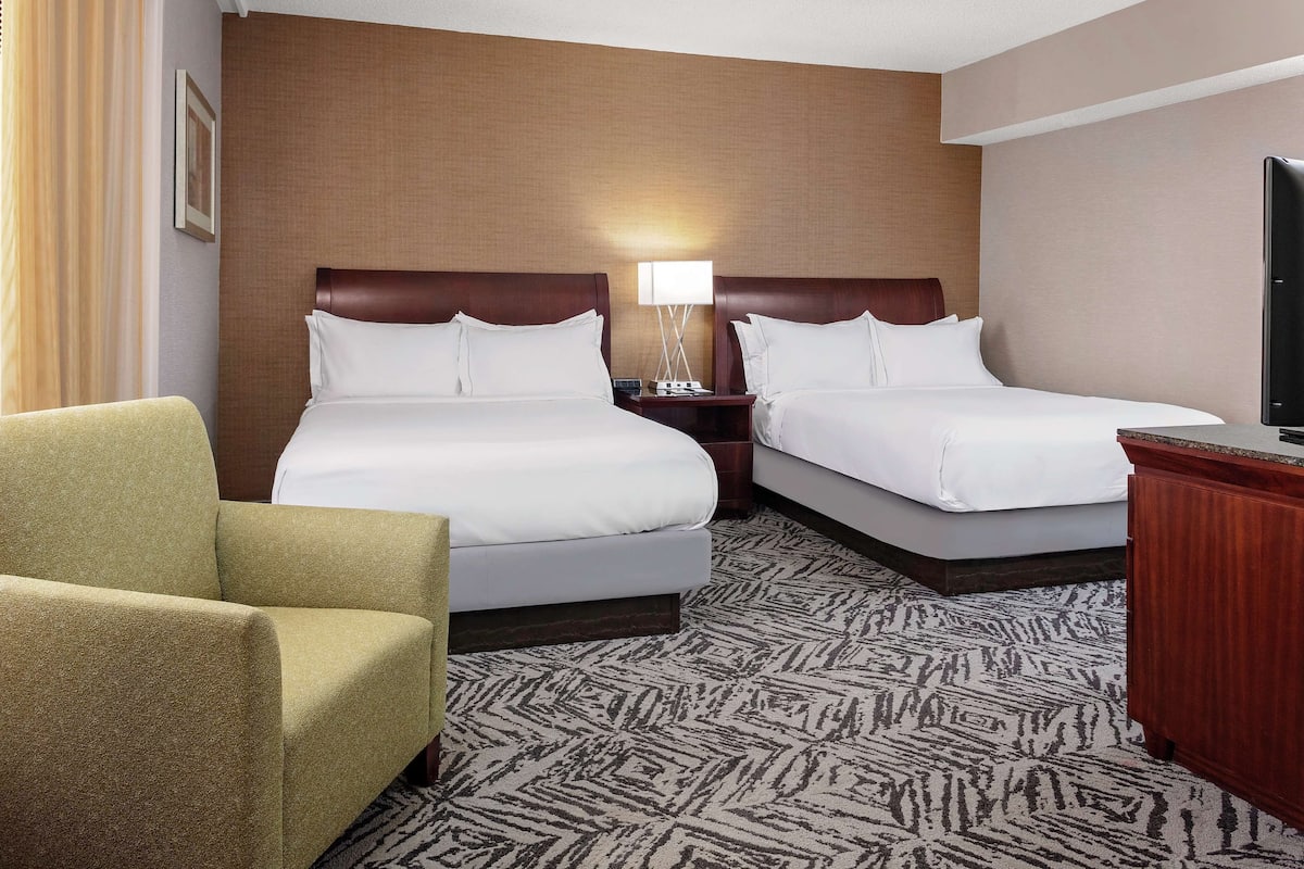 Premium bedding, desk, laptop workspace, iron/ironing board