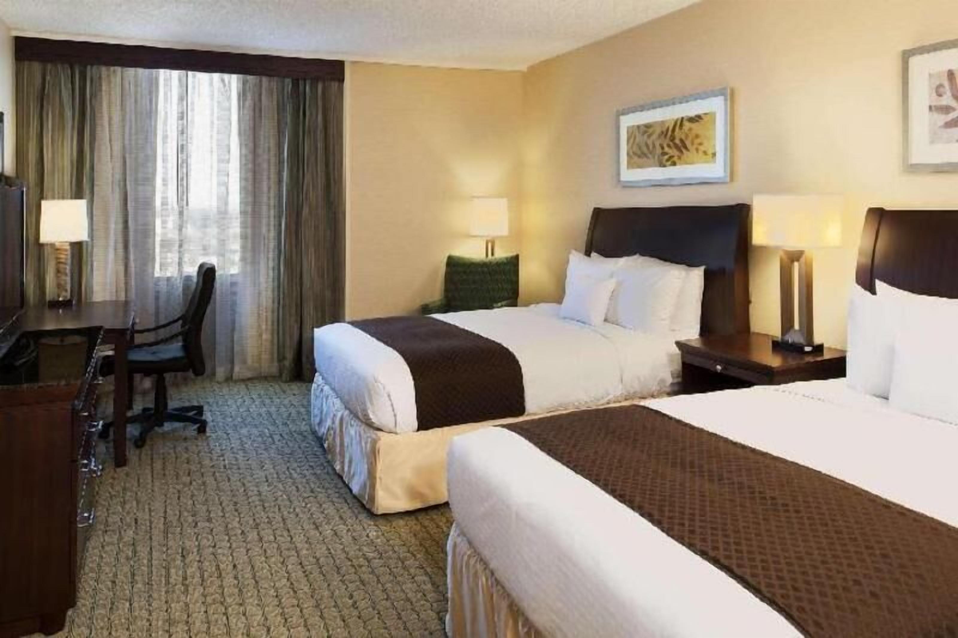 Premium bedding, desk, laptop workspace, iron/ironing board