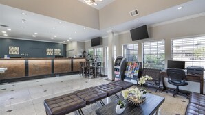 A spacious lobby with a reception desk, seating area, and ATM machines. - Best Western Airpark Hotel - LAX Airport LA  Stadium (Inglewood)