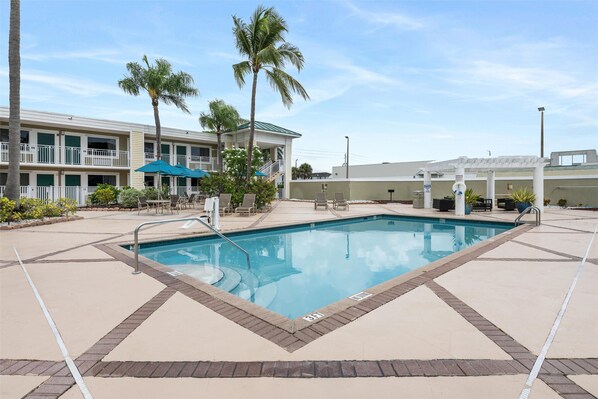 Outdoor pool, open 7 AM to 7:00 PM, pool umbrellas, sun loungers